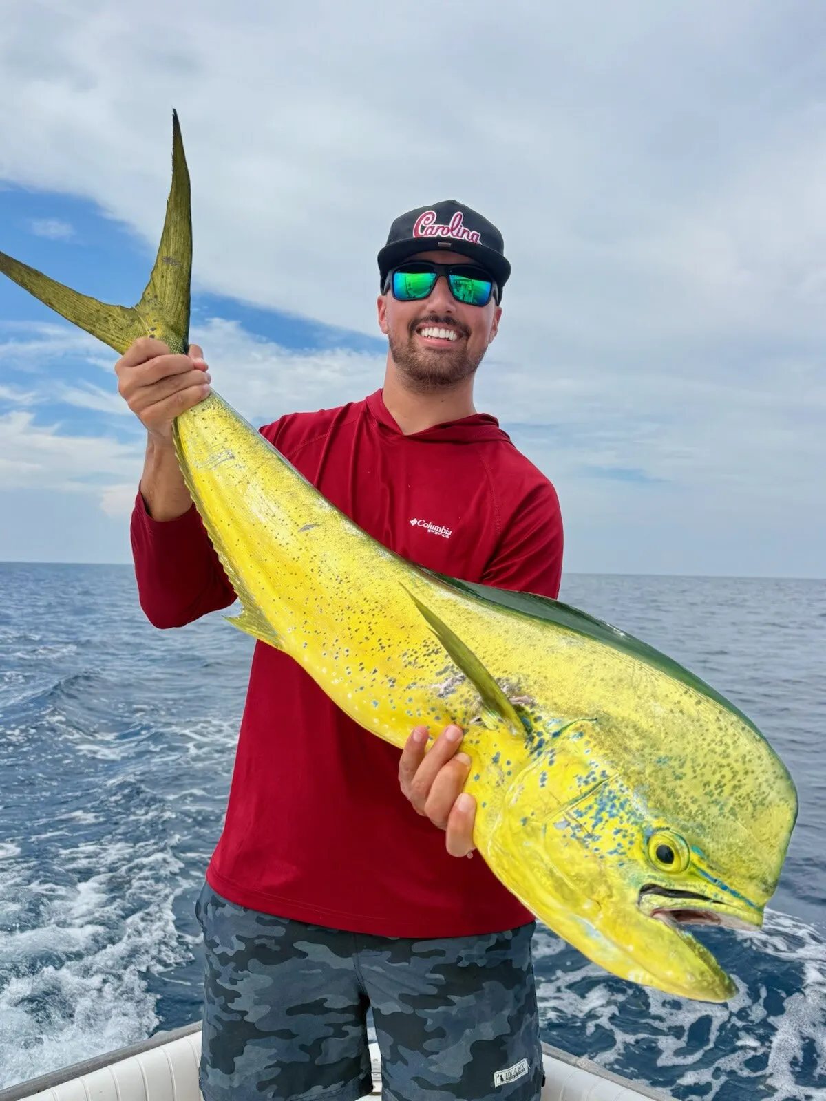 Angler with a bull mahi