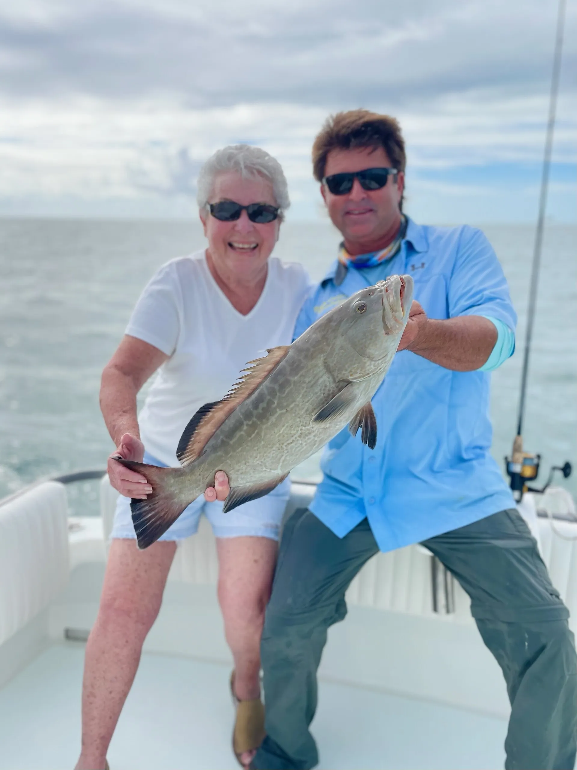 Guests with a black grouper