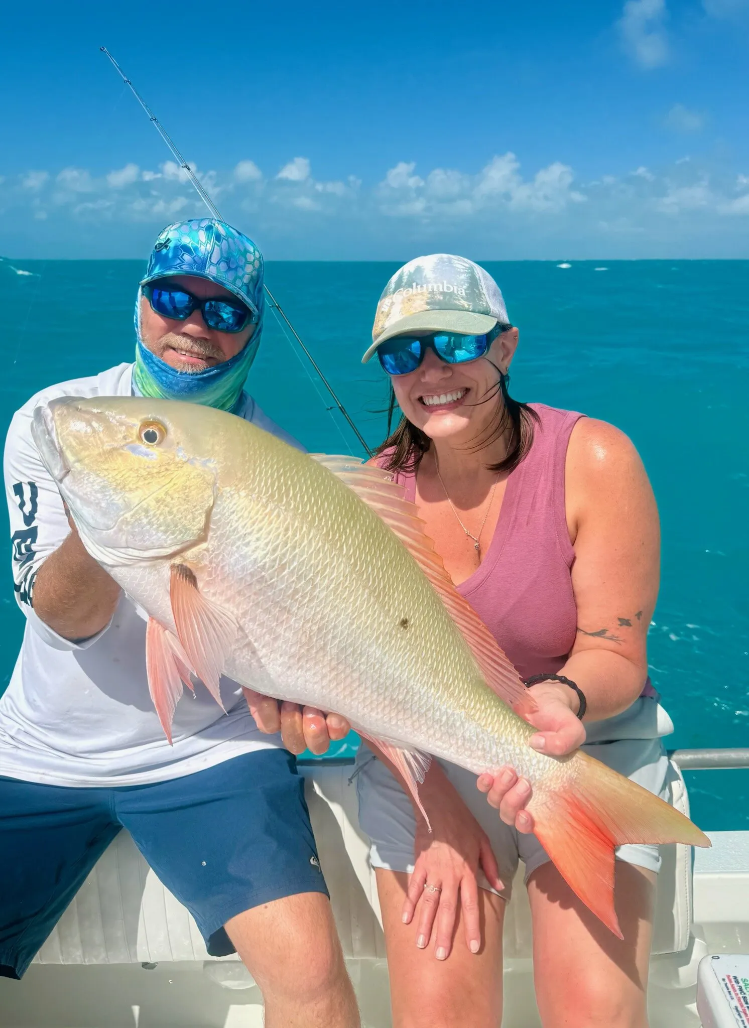Two anglers with a big mutton snapper