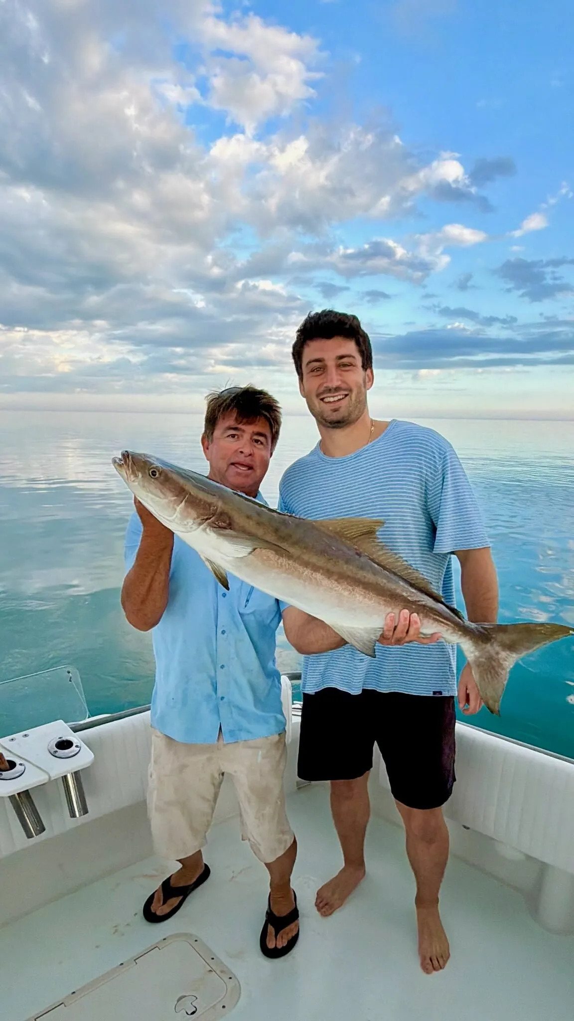 Two anglers with a cobia
