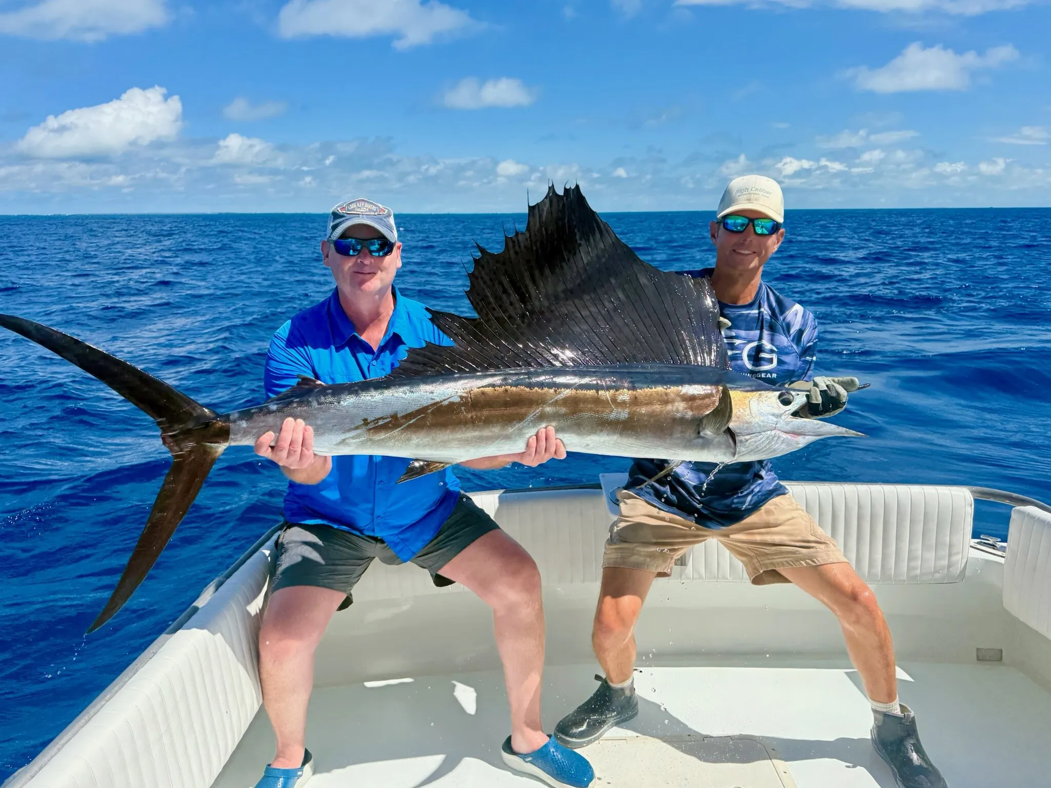 Two anglers with a sailfish offshore