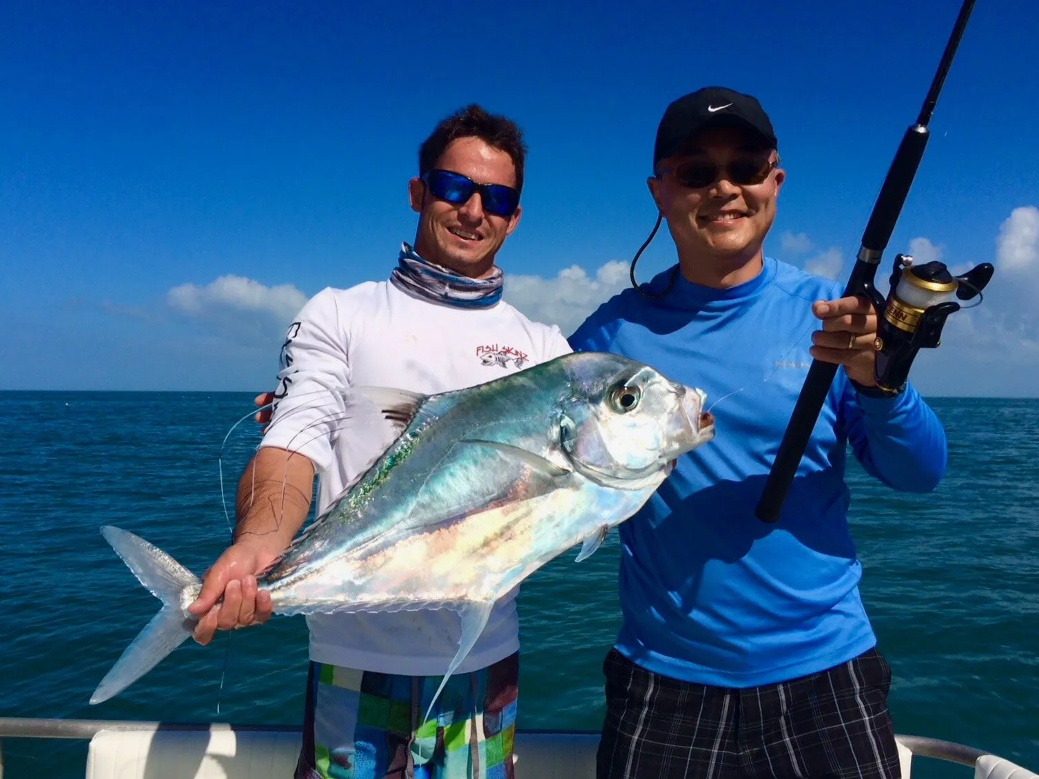Two anglers with an african pompano